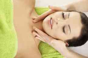 Face massage therapy at spa saloon