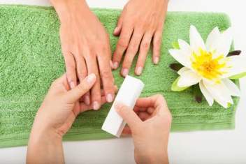 Beautician Polishing The Nails
