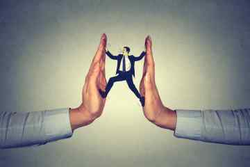 man between hands resisting pressure